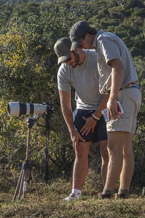 Students looking at camera in the field